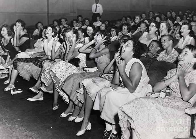 screaming-elvis-fans-in-theater-bettmann
